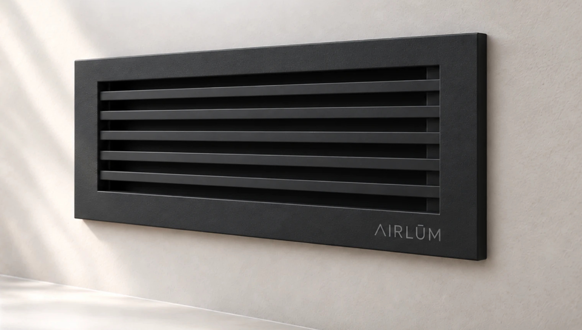 AIRLŪM wall vent mounted on a plaster wall